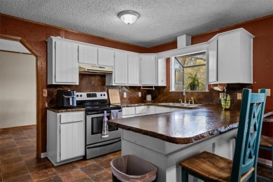 Embrace the tranquility of country living in this beautifully on Lake Whitney Country Club in Texas - for sale on GolfHomes.com, golf home, golf lot
