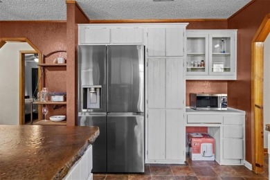 Embrace the tranquility of country living in this beautifully on Lake Whitney Country Club in Texas - for sale on GolfHomes.com, golf home, golf lot