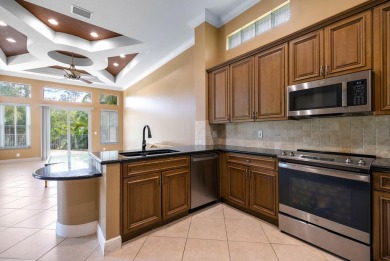 Elegant 4BR/3BA estate home in Osprey Isles, surrounded by on Palm Beach Gardens Golf Course in Florida - for sale on GolfHomes.com, golf home, golf lot