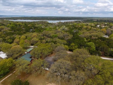 Embrace the tranquility of country living in this beautifully on Lake Whitney Country Club in Texas - for sale on GolfHomes.com, golf home, golf lot