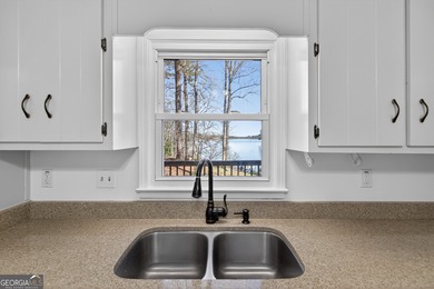 Lakefront Luxury Living with Stunning Views! This beautifully on Fairfield Plantation Golf and Country Club in Georgia - for sale on GolfHomes.com, golf home, golf lot