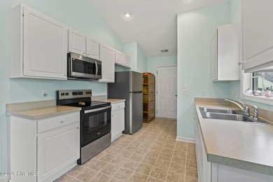 Beautifully maintained and freshly painted, this 4 bedroom, 3 on Crow Creek Golf Club in North Carolina - for sale on GolfHomes.com, golf home, golf lot