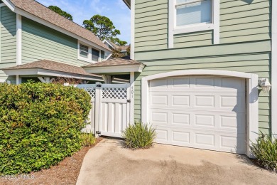 Unwind on your screened porch with front-row views of Davis on Ocean Creek Golf Course in South Carolina - for sale on GolfHomes.com, golf home, golf lot