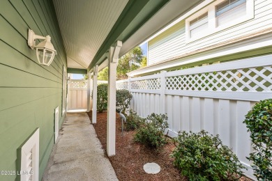 Unwind on your screened porch with front-row views of Davis on Ocean Creek Golf Course in South Carolina - for sale on GolfHomes.com, golf home, golf lot