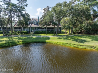 Unwind on your screened porch with front-row views of Davis on Ocean Creek Golf Course in South Carolina - for sale on GolfHomes.com, golf home, golf lot