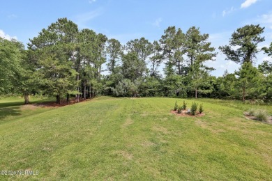 Welcome to your coastal sanctuary, where the tranquil shores of on Lockwood Folly Country Club in North Carolina - for sale on GolfHomes.com, golf home, golf lot