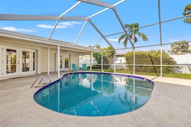 This spacious 4-bedroom, 3-bath POOL home is located in the on Mangrove Bay Golf Course in Florida - for sale on GolfHomes.com, golf home, golf lot