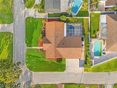 This spacious 4-bedroom, 3-bath POOL home is located in the on Mangrove Bay Golf Course in Florida - for sale on GolfHomes.com, golf home, golf lot