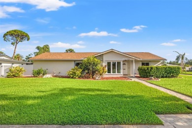 This spacious 4-bedroom, 3-bath POOL home is located in the on Mangrove Bay Golf Course in Florida - for sale on GolfHomes.com, golf home, golf lot