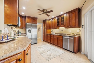 This spacious 4-bedroom, 3-bath POOL home is located in the on Mangrove Bay Golf Course in Florida - for sale on GolfHomes.com, golf home, golf lot