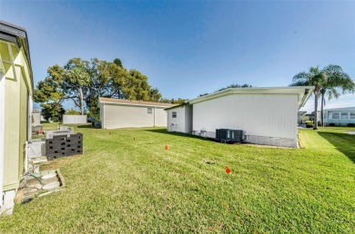 NEW PRICE ALERT - BEAUTIFULLY UPDATED DOUBLE-WIDE with FABULOUS on Tarpon Springs Golf Course in Florida - for sale on GolfHomes.com, golf home, golf lot