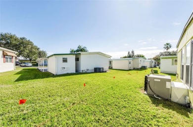 NEW PRICE ALERT - BEAUTIFULLY UPDATED DOUBLE-WIDE with FABULOUS on Tarpon Springs Golf Course in Florida - for sale on GolfHomes.com, golf home, golf lot