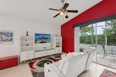 Spacious, meticulously maintained home in a gated community with on Woodmont Country Club in Florida - for sale on GolfHomes.com, golf home, golf lot