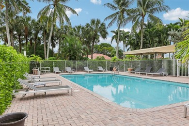 Spacious, meticulously maintained home in a gated community with on Woodmont Country Club in Florida - for sale on GolfHomes.com, golf home, golf lot