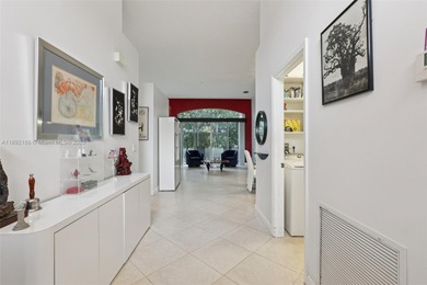 Spacious, meticulously maintained home in a gated community with on Woodmont Country Club in Florida - for sale on GolfHomes.com, golf home, golf lot