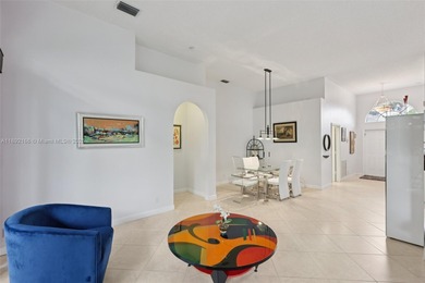 Spacious, meticulously maintained home in a gated community with on Woodmont Country Club in Florida - for sale on GolfHomes.com, golf home, golf lot