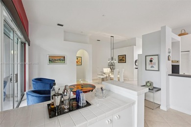 Spacious, meticulously maintained home in a gated community with on Woodmont Country Club in Florida - for sale on GolfHomes.com, golf home, golf lot