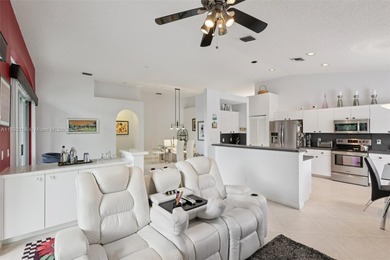 Spacious, meticulously maintained home in a gated community with on Woodmont Country Club in Florida - for sale on GolfHomes.com, golf home, golf lot