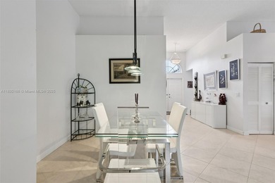 Spacious, meticulously maintained home in a gated community with on Woodmont Country Club in Florida - for sale on GolfHomes.com, golf home, golf lot