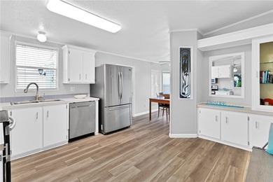 GOLF CART INCLUDED Beautifully updated split-bedroom home on Barefoot Bay Golf Course in Florida - for sale on GolfHomes.com, golf home, golf lot