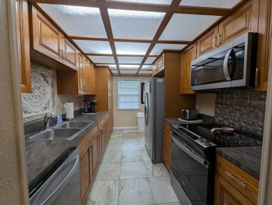 Experience Florida living at its finest in this exceptionally on Bayou Golf Club in Florida - for sale on GolfHomes.com, golf home, golf lot