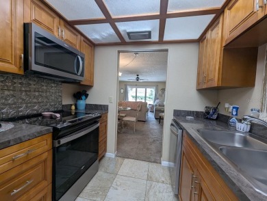 Experience Florida living at its finest in this exceptionally on Bayou Golf Club in Florida - for sale on GolfHomes.com, golf home, golf lot