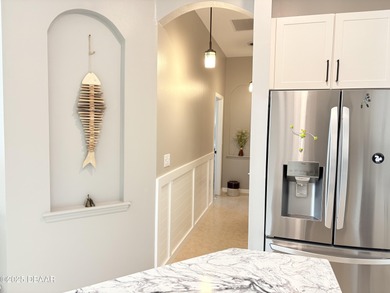 This 2 bed 2 bath + Bonus room, single-story end-unit townhome on Plantation Bay Golf and Country Club in Florida - for sale on GolfHomes.com, golf home, golf lot