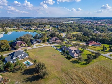 Under contract-accepting backup offers. Exclusive 1.09 Acre Lot on Lake Jovita Golf and Country Club in Florida - for sale on GolfHomes.com, golf home, golf lot