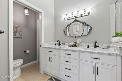 This 2 bed 2 bath + Bonus room, single-story end-unit townhome on Plantation Bay Golf and Country Club in Florida - for sale on GolfHomes.com, golf home, golf lot