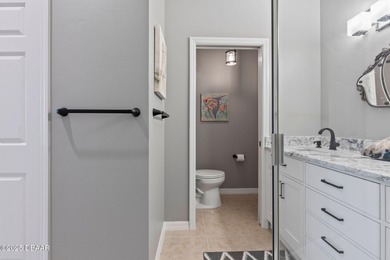 This 2 bed 2 bath + Bonus room, single-story end-unit townhome on Plantation Bay Golf and Country Club in Florida - for sale on GolfHomes.com, golf home, golf lot