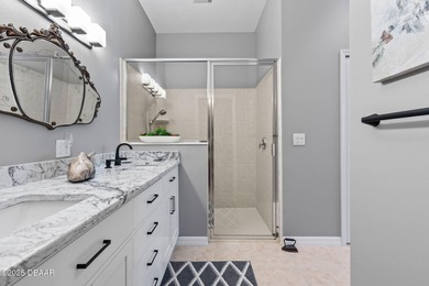 This 2 bed 2 bath + Bonus room, single-story end-unit townhome on Plantation Bay Golf and Country Club in Florida - for sale on GolfHomes.com, golf home, golf lot