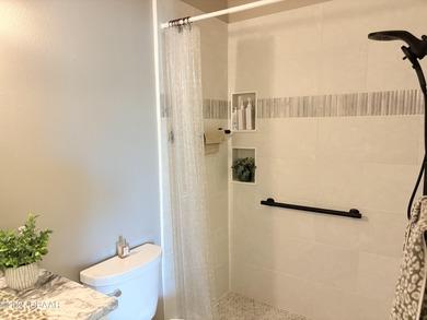 This 2 bed 2 bath + Bonus room, single-story end-unit townhome on Plantation Bay Golf and Country Club in Florida - for sale on GolfHomes.com, golf home, golf lot