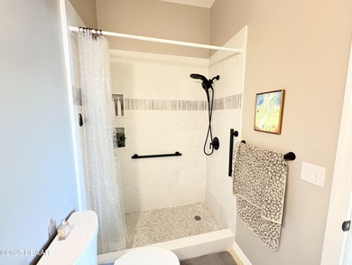 This 2 bed 2 bath + Bonus room, single-story end-unit townhome on Plantation Bay Golf and Country Club in Florida - for sale on GolfHomes.com, golf home, golf lot