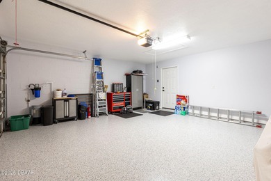 This 2 bed 2 bath + Bonus room, single-story end-unit townhome on Plantation Bay Golf and Country Club in Florida - for sale on GolfHomes.com, golf home, golf lot