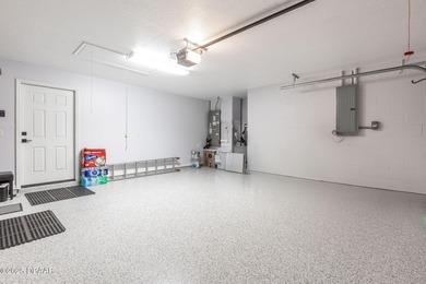 This 2 bed 2 bath + Bonus room, single-story end-unit townhome on Plantation Bay Golf and Country Club in Florida - for sale on GolfHomes.com, golf home, golf lot