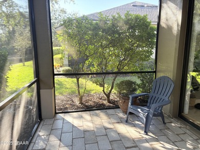 This 2 bed 2 bath + Bonus room, single-story end-unit townhome on Plantation Bay Golf and Country Club in Florida - for sale on GolfHomes.com, golf home, golf lot