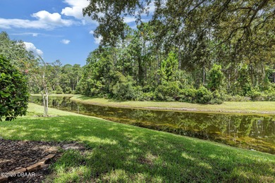 This 2 bed 2 bath + Bonus room, single-story end-unit townhome on Plantation Bay Golf and Country Club in Florida - for sale on GolfHomes.com, golf home, golf lot