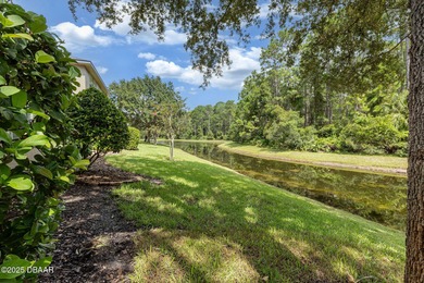 This 2 bed 2 bath + Bonus room, single-story end-unit townhome on Plantation Bay Golf and Country Club in Florida - for sale on GolfHomes.com, golf home, golf lot