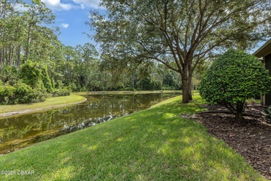 This 2 bed 2 bath + Bonus room, single-story end-unit townhome on Plantation Bay Golf and Country Club in Florida - for sale on GolfHomes.com, golf home, golf lot