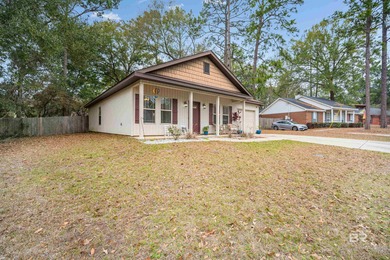 Welcome home to this precious cottage tucked away on a quiet on Lake Forest Yacht and Country Club in Alabama - for sale on GolfHomes.com, golf home, golf lot