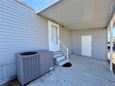 Effortless Florida Living in Caribbean Isles Residential on Apollo Beach Golf and Sea Club in Florida - for sale on GolfHomes.com, golf home, golf lot