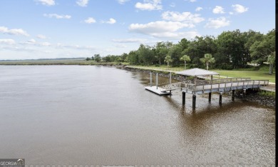 Beautiful custom designed home is a coastal retreat located in on The Golf Club At Sanctuary Cove in Georgia - for sale on GolfHomes.com, golf home, golf lot