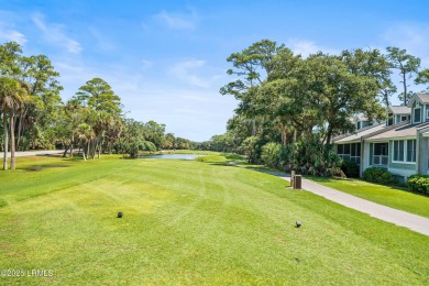 Nestled along Davis Love's picturesque 16th fairway with a on Ocean Creek Golf Course in South Carolina - for sale on GolfHomes.com, golf home, golf lot