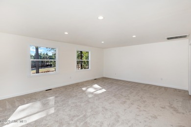 Recently renovated golf-front home perfectly positioned on the on Seven Lakes Country Club in North Carolina - for sale on GolfHomes.com, golf home, golf lot