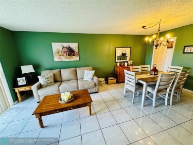 This inviting 55+ community condo offers an exceptional blend of on Sunrise Lakes Phase IV Golf Course in Florida - for sale on GolfHomes.com, golf home, golf lot