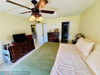 This inviting 55+ community condo offers an exceptional blend of on Sunrise Lakes Phase IV Golf Course in Florida - for sale on GolfHomes.com, golf home, golf lot