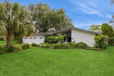 Tucked inside a charming Cul de sac, this 3 bedroom, 2 bath plus on The Dunedin Country Club in Florida - for sale on GolfHomes.com, golf home, golf lot