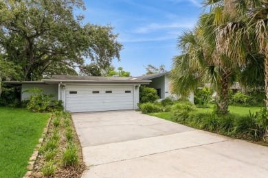 Tucked inside a charming Cul de sac, this 3 bedroom, 2 bath plus on The Dunedin Country Club in Florida - for sale on GolfHomes.com, golf home, golf lot