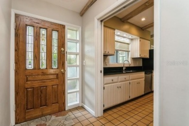 Tucked inside a charming Cul de sac, this 3 bedroom, 2 bath plus on The Dunedin Country Club in Florida - for sale on GolfHomes.com, golf home, golf lot