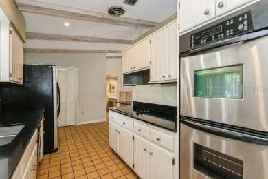 Tucked inside a charming Cul de sac, this 3 bedroom, 2 bath plus on The Dunedin Country Club in Florida - for sale on GolfHomes.com, golf home, golf lot